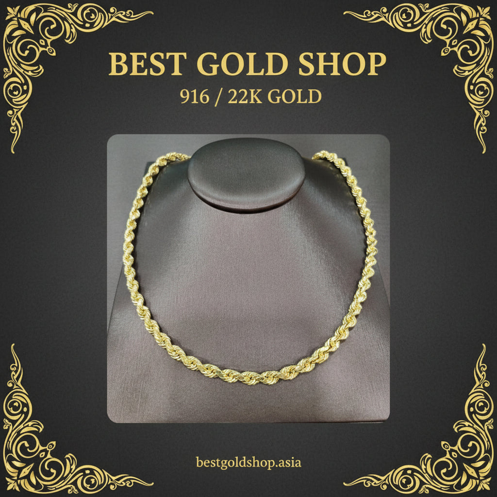 916 gold rope necklace arranged on a grey display bust