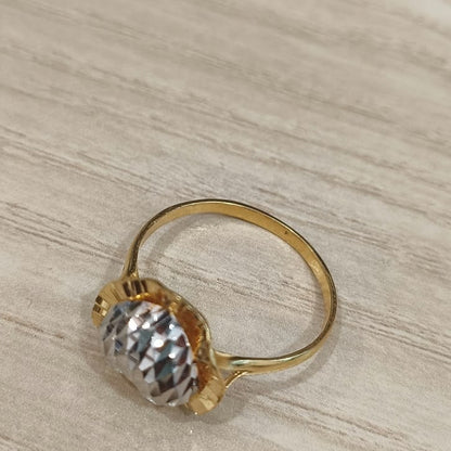 916 gold two-tone heart ring viewed from above showing the circular band and raised textured heart detail