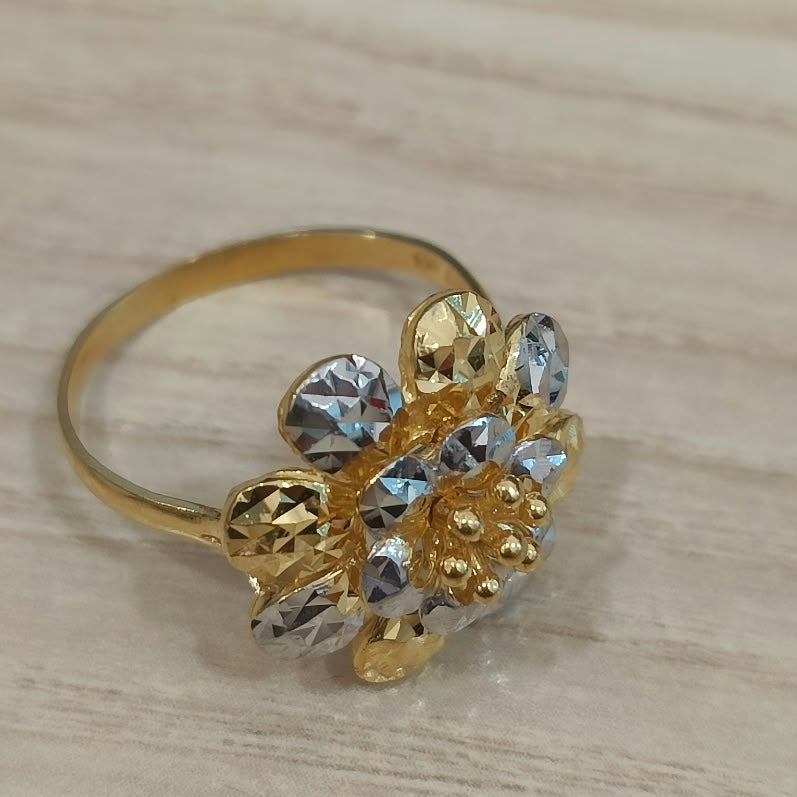 916 gold two-tone floral cluster ring viewed from the opposite side with its band and faceted petals visible