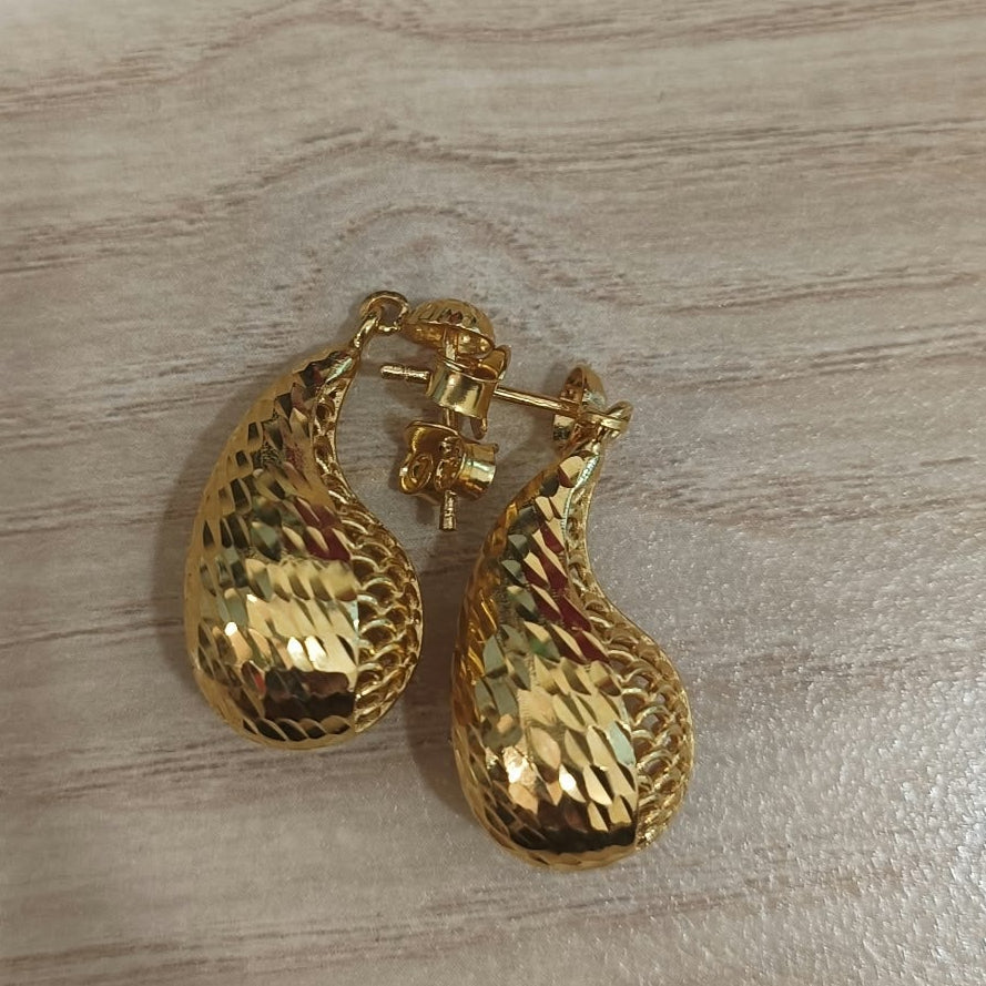 916 gold teardrop earrings viewed from above showing the textured drop shapes, posts and push backs