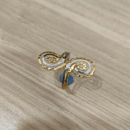 Top view of a 916 gold two-tone swirl ring showing the paired spirals and contrasting silver-coloured accents