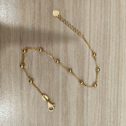 Adjustable 916 gold bead station bracelet with heart end tag