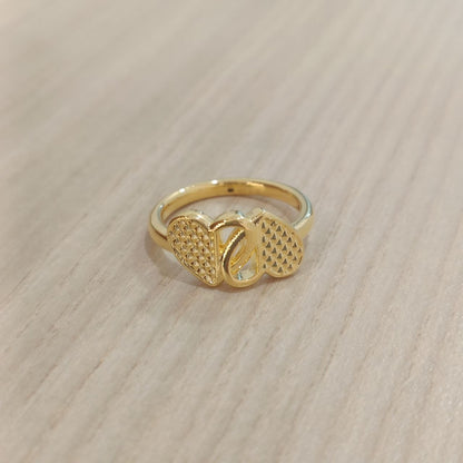 Angled front view of 916 gold cross heart ring