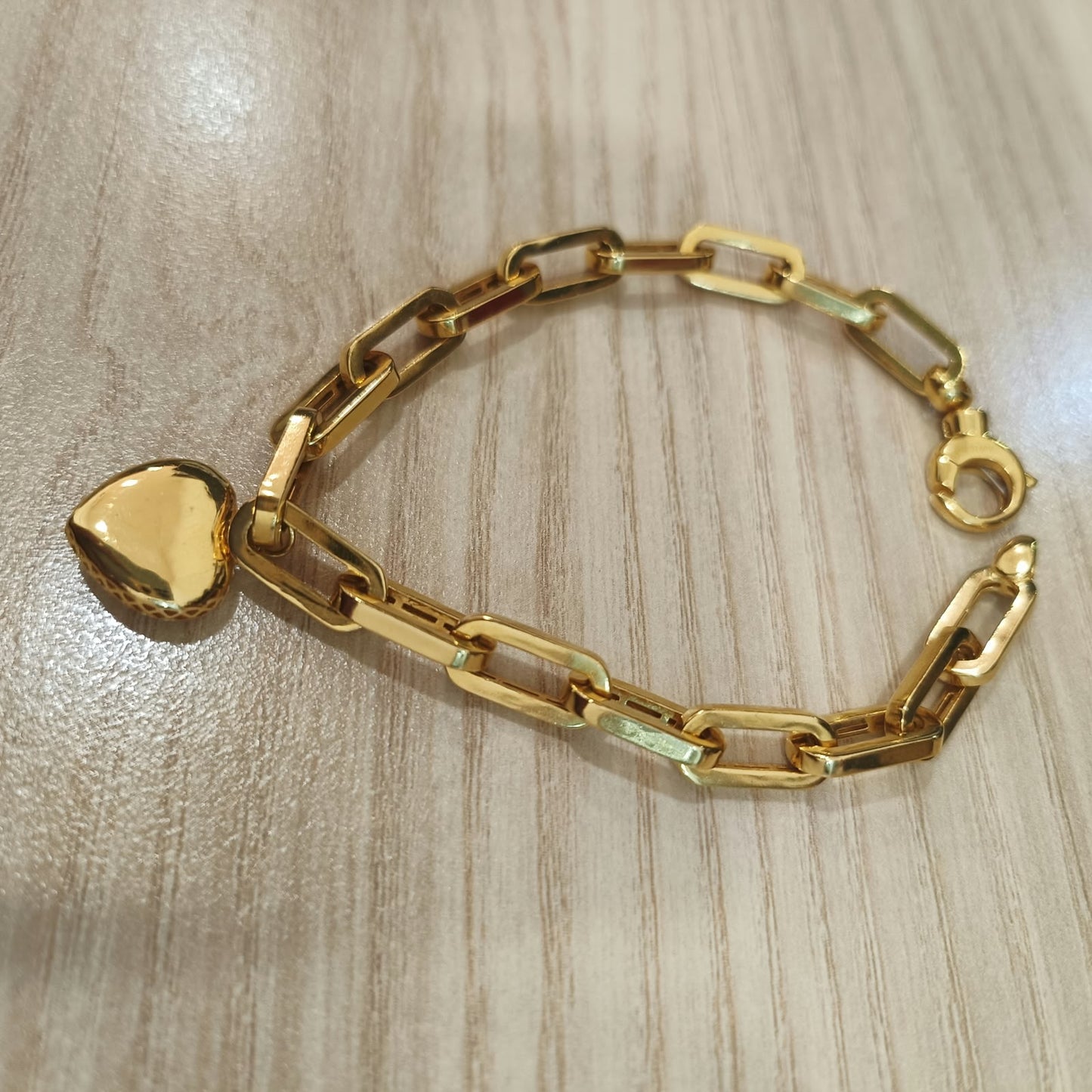 916 gold dangling heart bracelet angled view