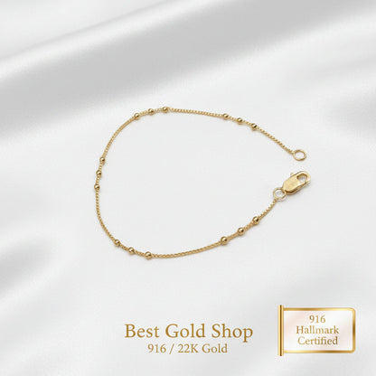 Detailed view of polished bead stations on a 916 Gold bracelet.