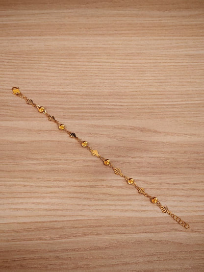 916 gold fancy shell ball bracelet laid flat