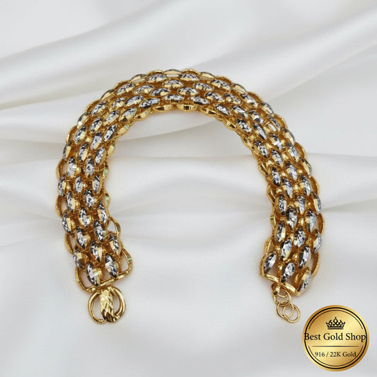 Front view of the 916 gold Fancy bracelet in an open U shape, showing yellow-gold links, silver-coloured faceted surfaces and clasp ends