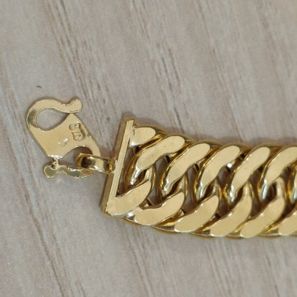 Full view of the 916 gold hollow Lipan statement bracelet