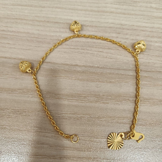 916 Gold hollow rope bracelet showing heart charms and clasp