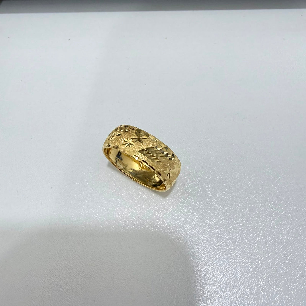 916 gold hollow sandy ring V1, low angled view