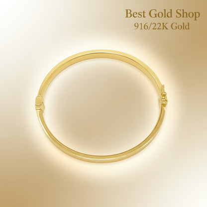 Polished 916 gold hollow shiny bangle with reflective glow