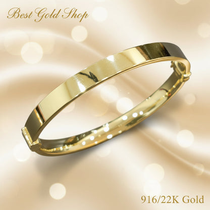 Pair view of polished 916 gold hollow shiny bangles