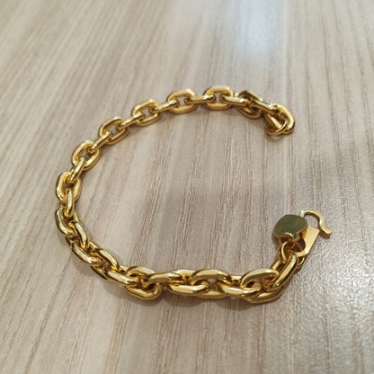 Side view of polished 916 gold hollow Wanzi bracelet