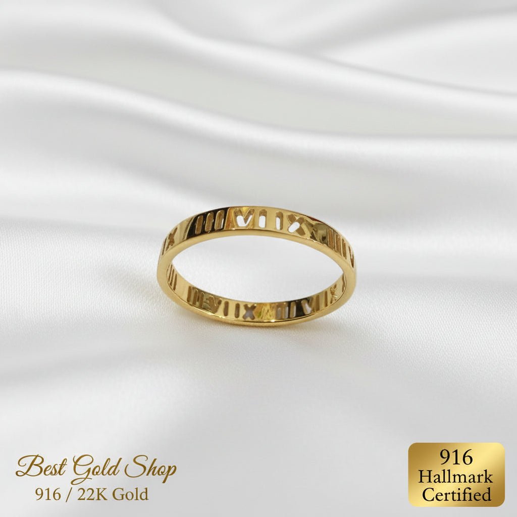 916 gold mini Roman numeral ring standing on white fabric