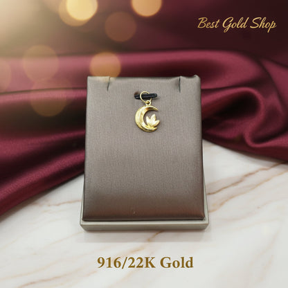 Detailed view of the floral motif on a 916 gold moon pendant