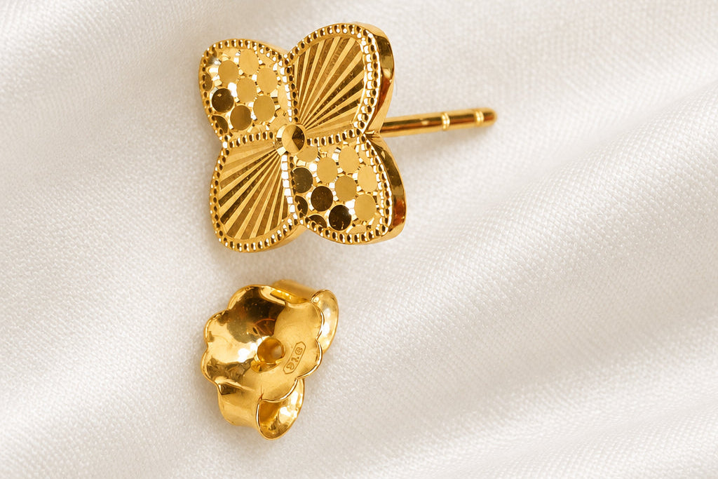 916 gold petal earring with separate backing on light fabric