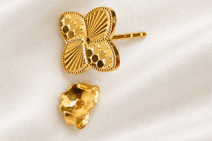 916 gold petal earring with separate backing on light fabric