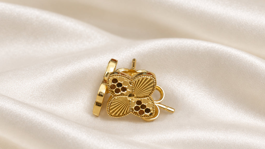 916 gold petal earrings showing the patterned front and side profile on cream satin