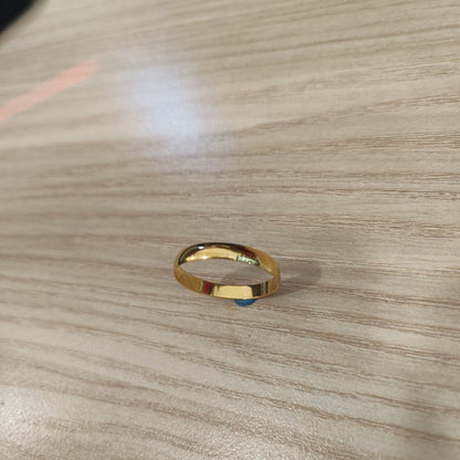 Angled view of 916 gold slim plain polished band ring