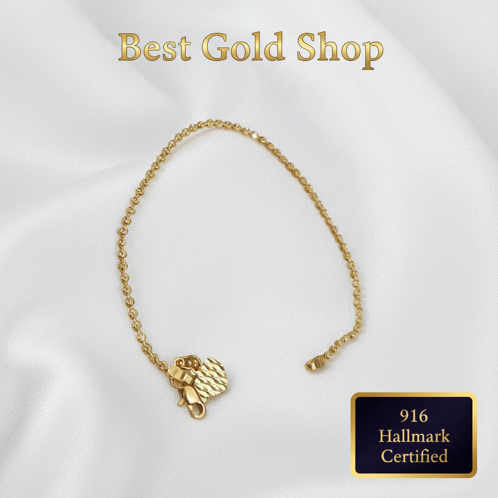Full-length view of 916 Gold Solid Bead Bracelet with Heart Charm.