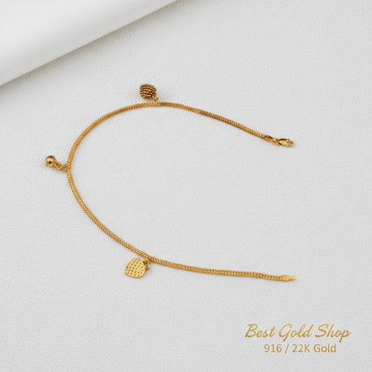 916 gold anklet with textured heart charms and a bell