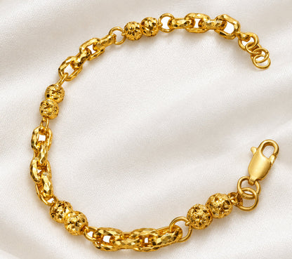 916 gold Wan Zi ball bracelet in an open oval showing faceted links and extension rings