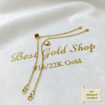 916 Gold Wan Zi Dangling Heart Bracelet | Slim 22K Design - View 1