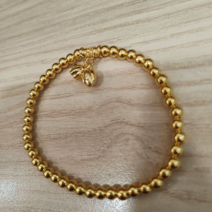 999 gold bead lotus bracelet showing floral charms - angled view