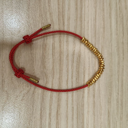 999 gold bead strand bracelet on red cord - alternate full view
