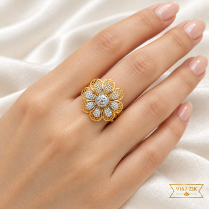 916 gold two-tone floral ring worn on a hand showing its flower design