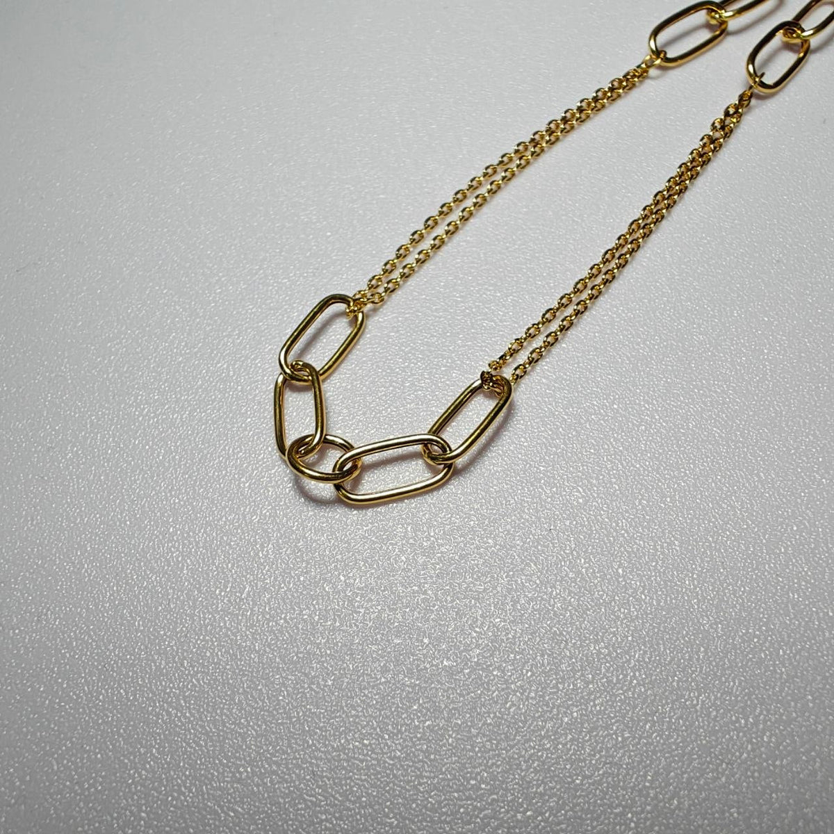 Close-up of oval loop links on 916 gold WanZi necklace