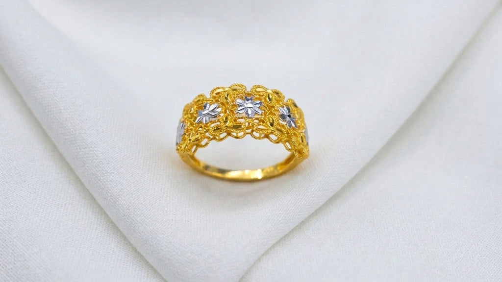 Front view of the 916 gold Serenity Petal two-tone ring with silver-colour flowers in a yellow-gold openwork panel