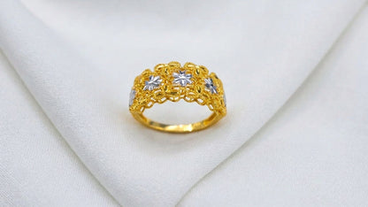 Front view of the 916 gold Serenity Petal two-tone ring with silver-colour flowers in a yellow-gold openwork panel