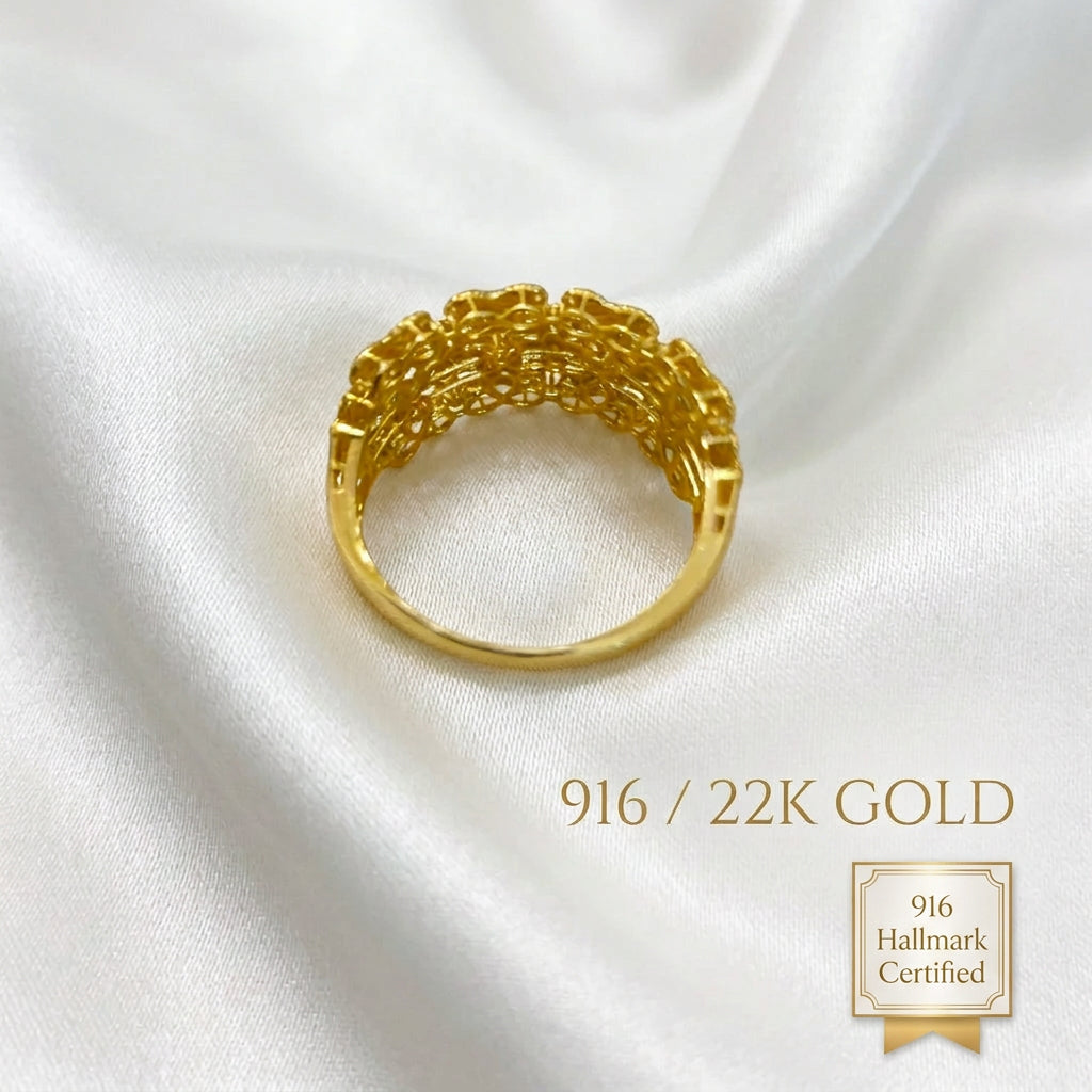 Underside view of the 916 gold Serenity Petal ring showing the openwork floral panel and circular band
