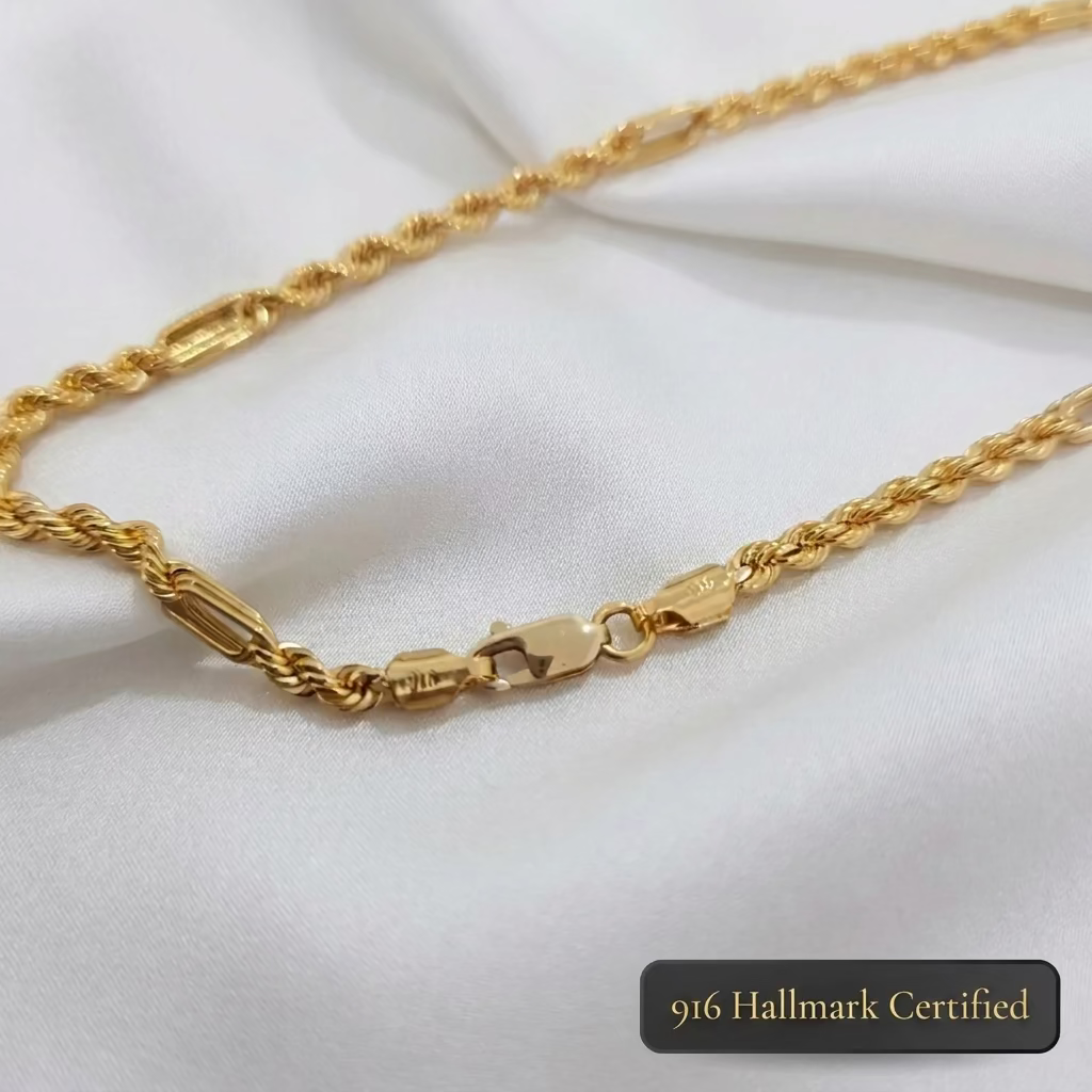 Close-up of the clasp and alternating twisted rope and elongated links on a 916 gold Hollow Rope C chain necklace