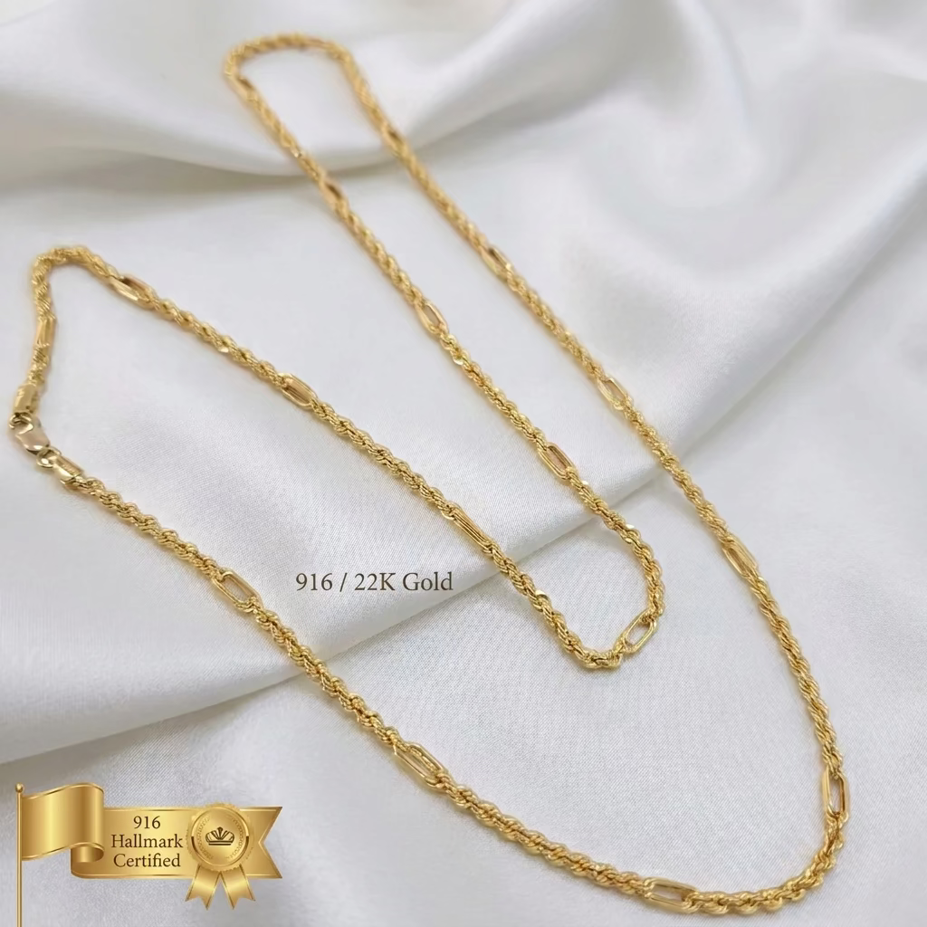 916 gold Hollow Rope C chain necklace arranged in loose loops on white fabric, showing twisted rope sections and elongated links