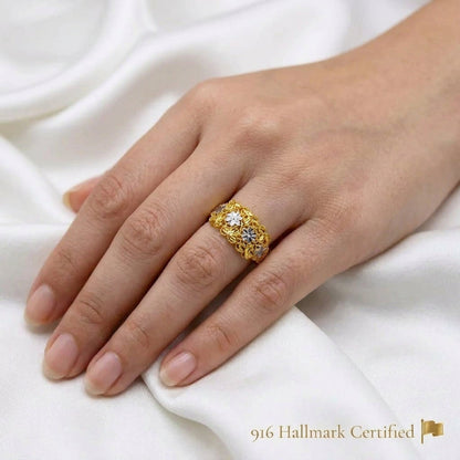 916 gold Serenity Petal two-tone floral ring worn on a hand, showing its decorative openwork panel