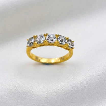 Front view of 916 gold eternity-style ring showing five round silver-coloured accents and a polished gold band