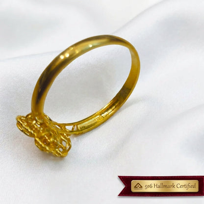 Close-up underside view of the 916 gold blossom ring showing the open flower setting and inner band