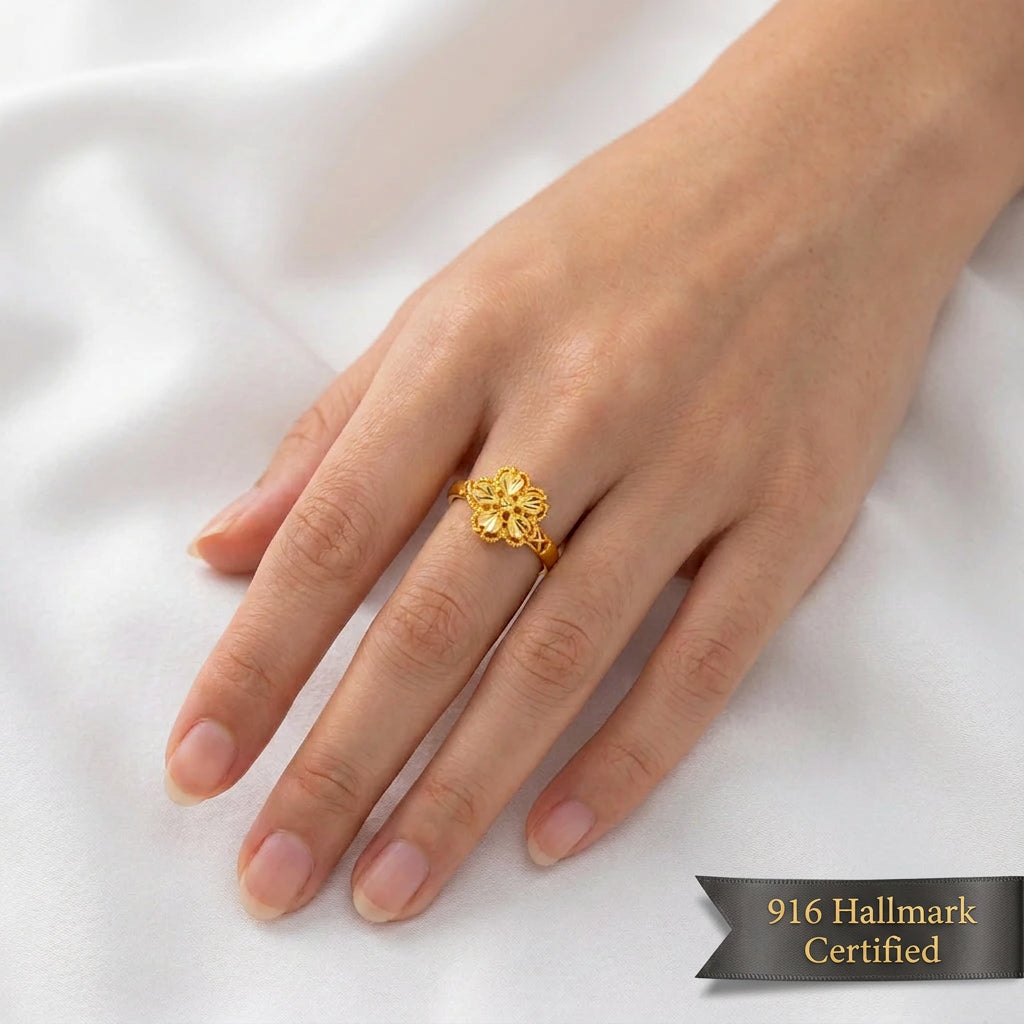 916 gold blossom ring worn on a hand showing the floral motif and openwork shoulders