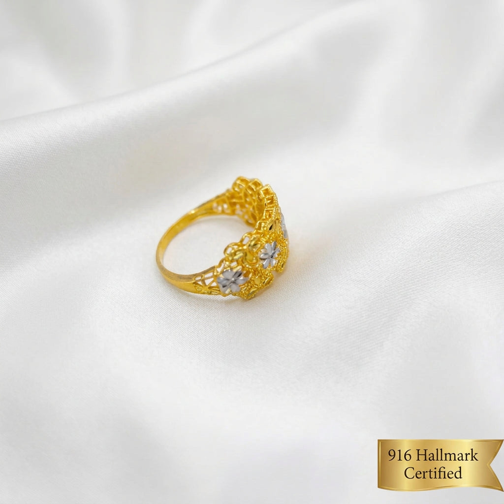 Side angle of the 916 gold Serenity Petal two-tone ring showing the floral panel and smooth band