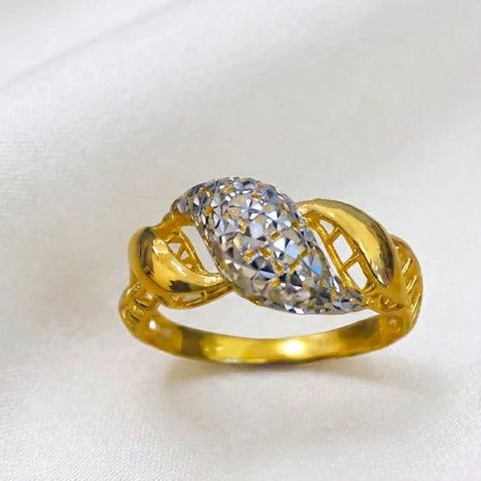Front view of 916 gold two-tone twist ring with a faceted silver-coloured centre, curved gold sections and openwork sides